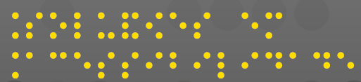 Imagem: Texto ‘Soluções em Acessibilidade’ escrito em pontos braille em amarelo. Fim da imagem.