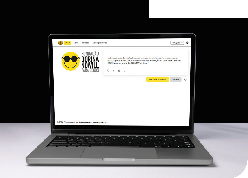 Imagem: Fotografia. Um notebook cinza está aberto sobre uma superfície branca, com a tela voltada para a frente, onde há uma página de internet com barra superior branca e itens de menu: Início, Docx, Revisões e Descrições salvas; à direita, um seletor com o texto Português e um ícone de engrenagem. Abaixo, à esquerda, logotipo da Fundação Dorina Nowill para Cegos. À direita, há uma caixa de texto com conteúdo digitado seguida por dois botões: Descrever novamente e Cancelar. Na parte inferior esquerda da tela, a informação: copyright 2026. Criado com amor por Fundação Dorina Nowill para Cegos. Fim da imagem.